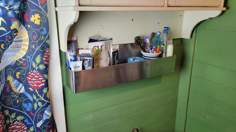 Tooth-cleaning products removed to the wall-mounted bar caddy