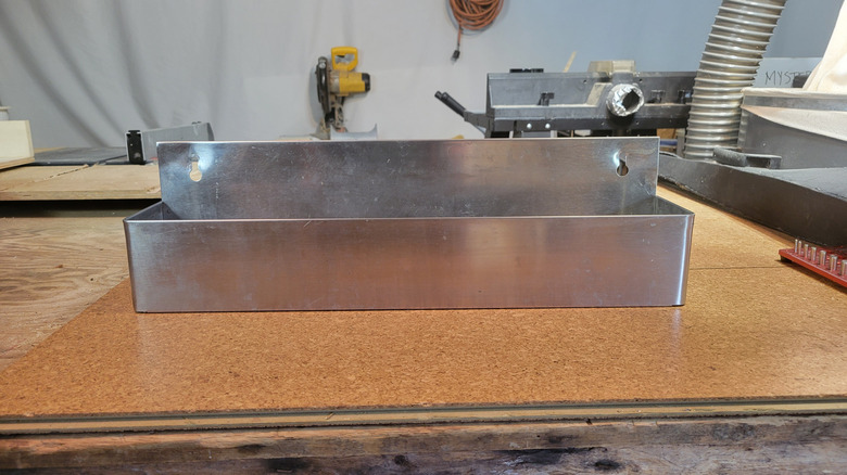 A thrifted bar caddy sitting on a work surface