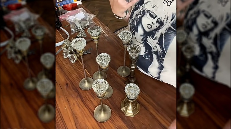 Creator showing her decorations made from crystal door knobs