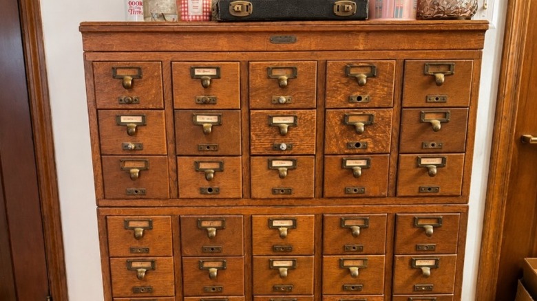 Card catalog drawer filled with paint supplies