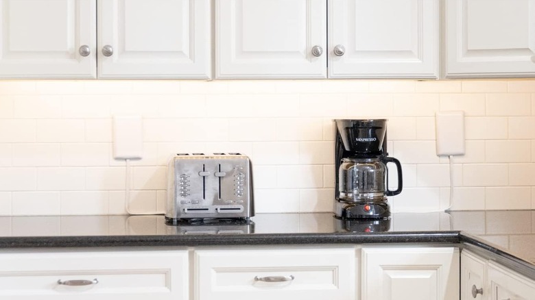 toaster and coffee maker with electrical cords hidden by the sleek socket product