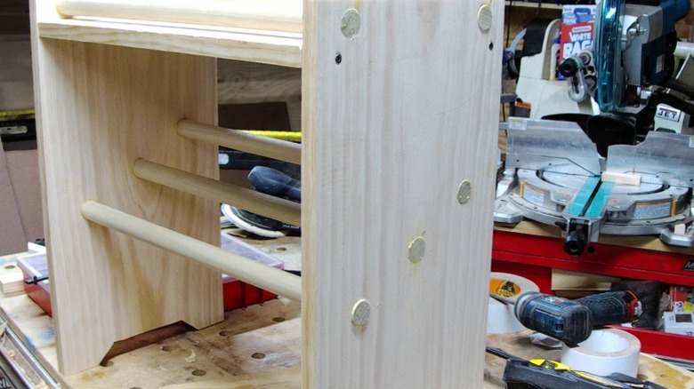 An assembled unfinished wood shoe rack