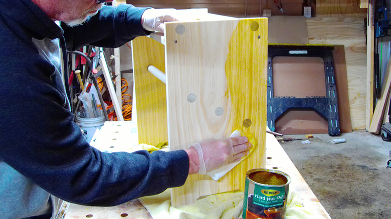 Applying hard wax oil to a shoe rack