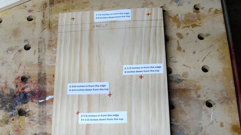 Layout mark locations for dowel holes on a wood board