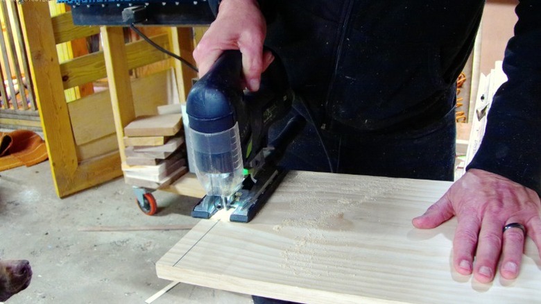 Trimming a 1-by-12 square with a handheld jigsaw