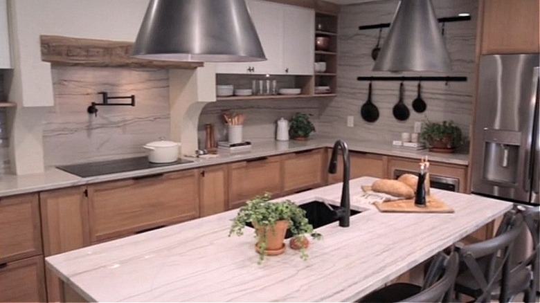 Modern kitchen with quartzite countertops and backsplash