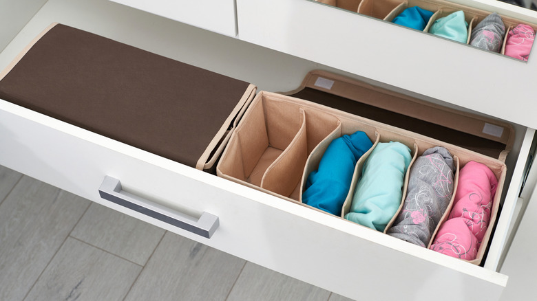 Containers and dividers parcel out drawer space for specific purposes