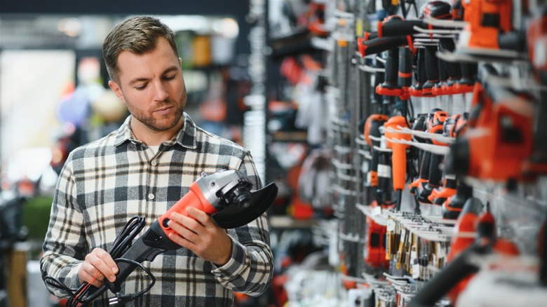 A customer looking at tools in a hardware store