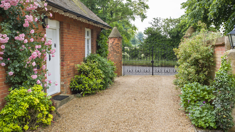 Quaint home with beautiful gravel driveway.