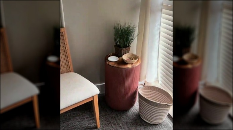 Decorated plant pot hamper beside a chair