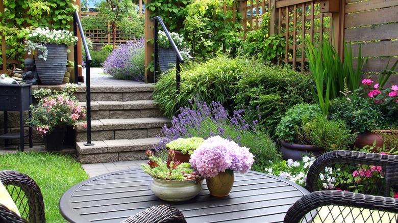 small backyard garden and patio seating area