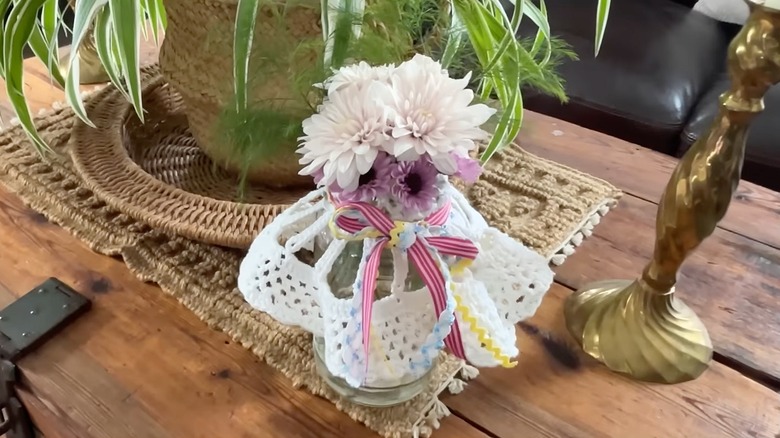Jar and doily turned into beautiful spring vase