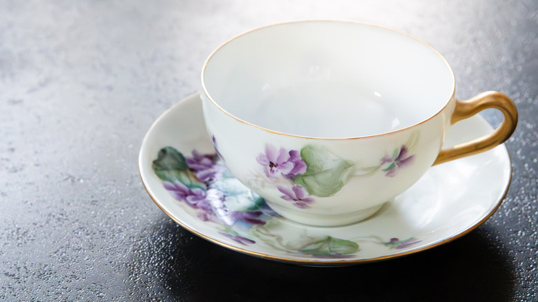 Vintage floral teacup sitting on saucer