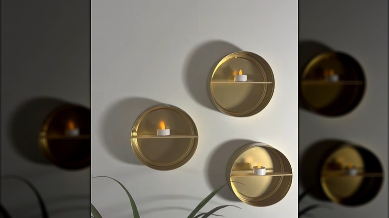 DIY wall shelves made from cookie tins with shelves added