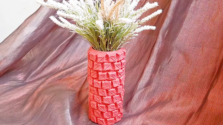 DIY vase made from cans covered in pieces of egg carton