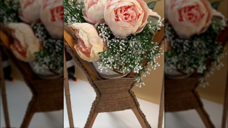 Floral display made from four wooden hangers as the base