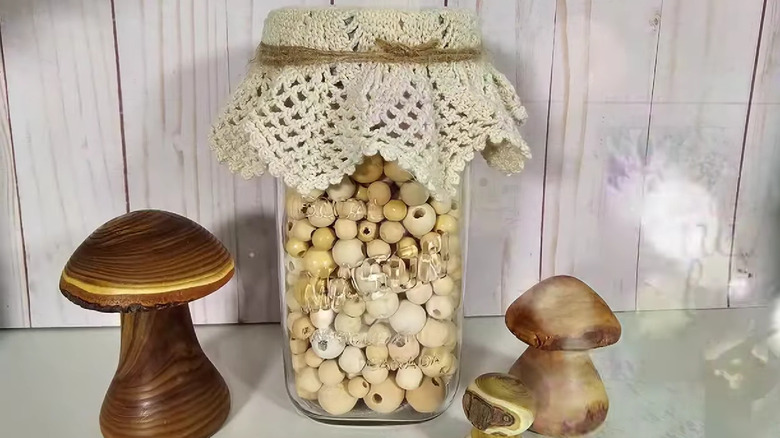 Mason jar with a vintage doily decorating the lid