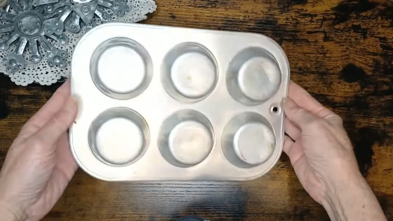 Crafter holding an old six-cup cupcake pan