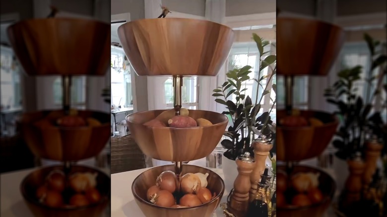 Three-tiered tray made from wooden bowls and candlesticks