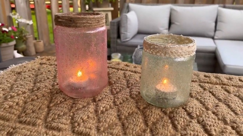 Crackle glass jar lanterns with lit tealights inside