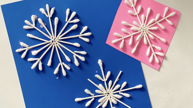 cotton swab snowflake ornaments and art on construction paper
