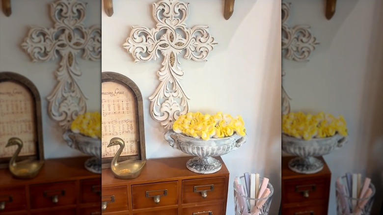 A ruffled doily in an antique vase