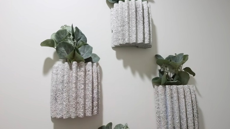 Wall art with plants inside