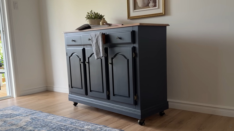 Repurposed hutch turned into a rolling island painted dark blue
