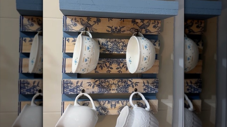 Coffee mugs on a DIY hanging holder made from a mini pallet