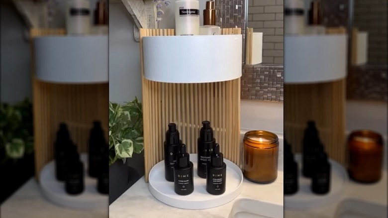 DIY shelf made from a round box and wooden dowels