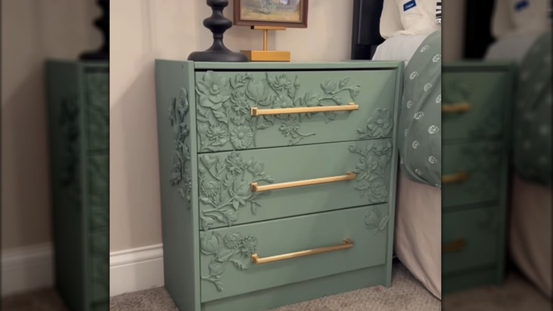 IKEA RAST three-drawer dresser painted with three-dimensional floral designs and new hardware added