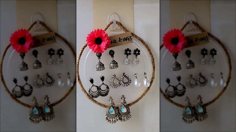 DIY jewelry storage solution made from old plastic lid