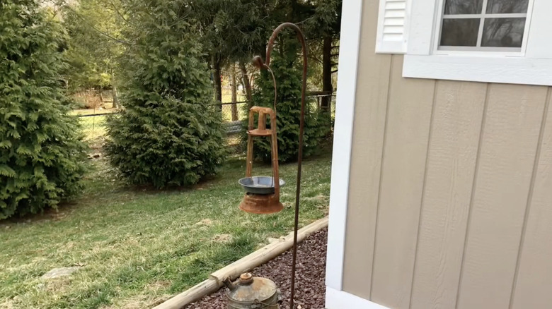 Old kerosene lamp turned bird feeder