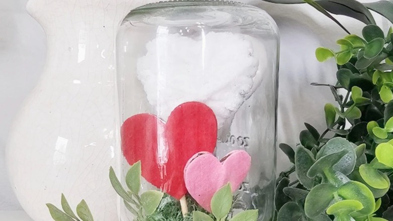 Finished DIY Valentine's Day decor made out of glass jar.