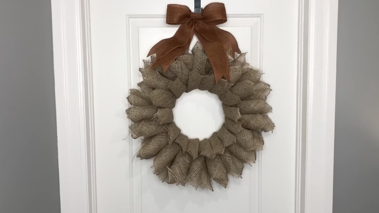 DIY burlap wreath hanging on door