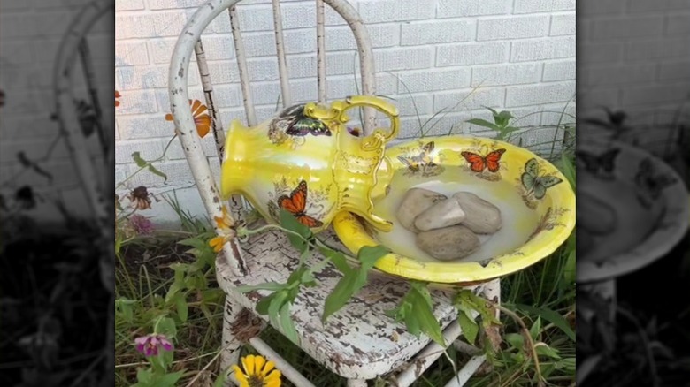 pitcher and basin on chair as bird bath