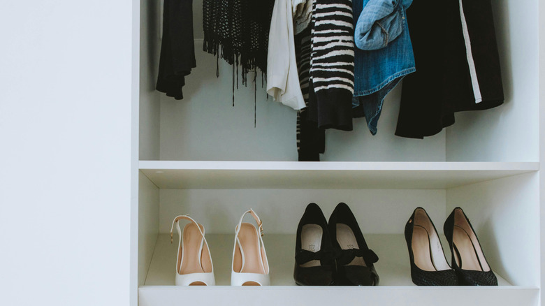 Recessed shoe storage with hanging jackets above