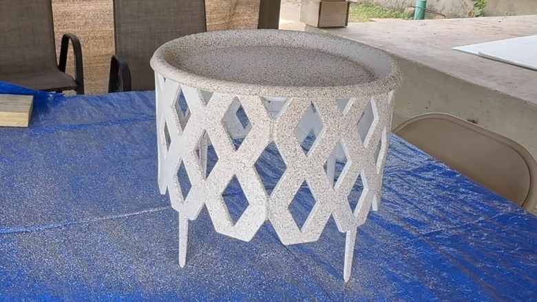 Dollar Tree garden fences and tray turned into a DIY patio table