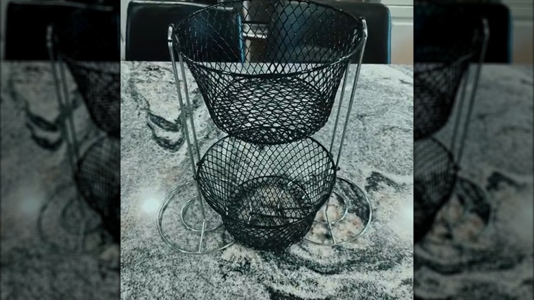 Two-tiered storage made from wire baskets and paper towel holders
