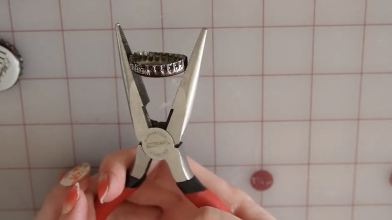 holding bottle cap with pliers