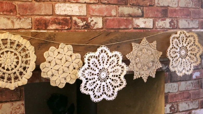 Doily bunting across fireplace mantel