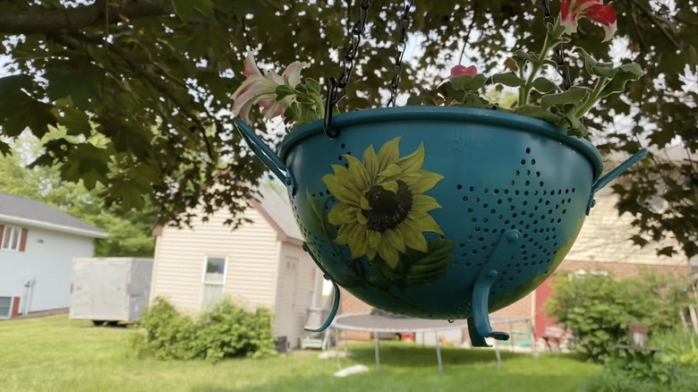 painted strainer turned into hanging flower basket