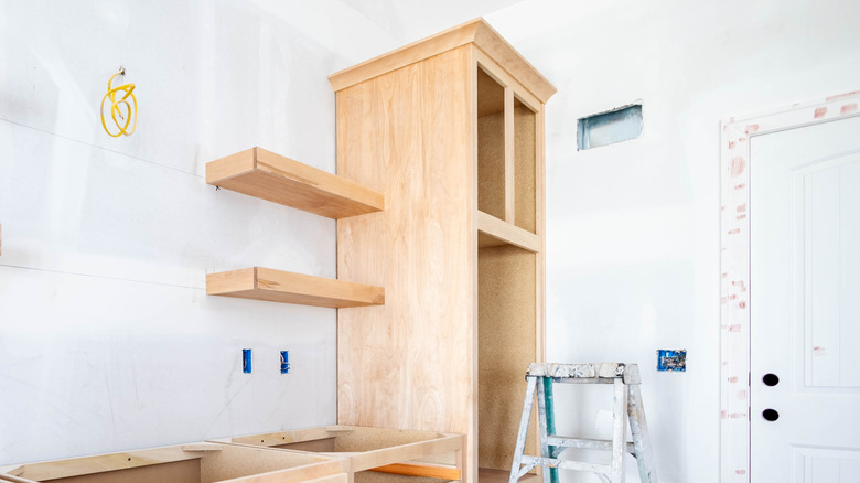 Floating shelves attached to kitchen cabinet