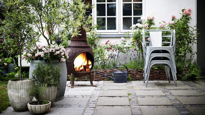 Granite paver patio with outdoor fireplace.