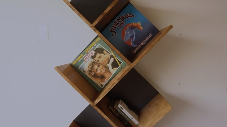 Modern record storage shelf with tilted cubbies