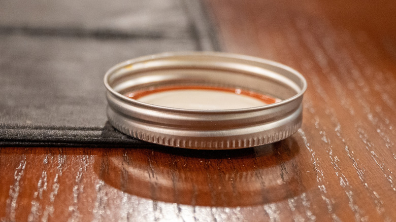 upside down Mason jar lid on a table