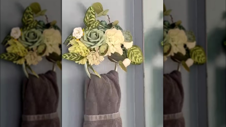 Basic towel ring covered with a pool noodle and faux flowers