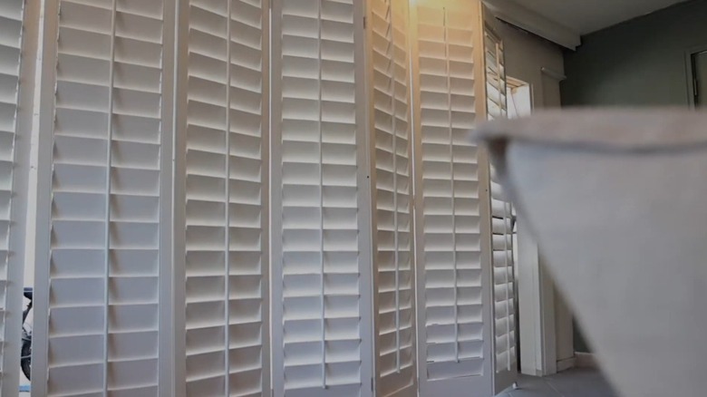 Privacy screen made from shutters.