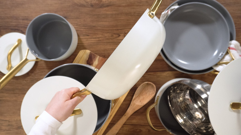 Person sorting pots and pans