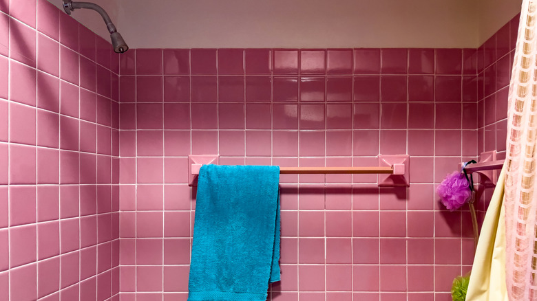 Outdated bubble-gum pink tiled bathroom